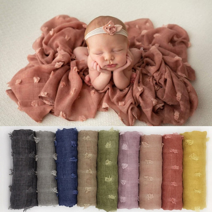 Ultra-soft infant swaddle blanket in gentle cotton for secure, cozy newborn sleep & comfort.