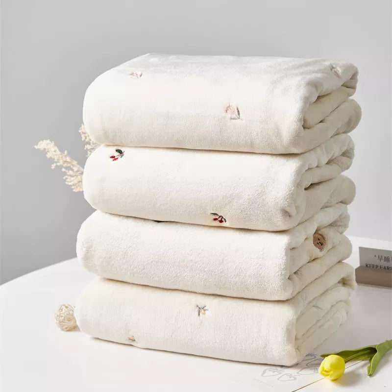Ultra-soft winter baby blanket in cream, perfect for newborn comfort & nursery decor.