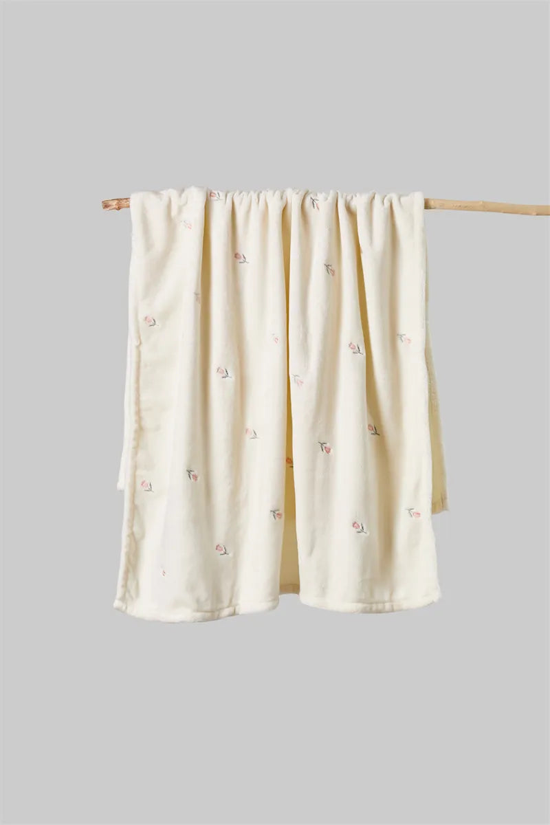 Luxurious newborn blanket, showcasing its thickness and warmth for chilly days.