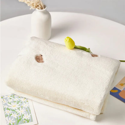 Newborn winter blanket, folded neatly. A snug baby comfort item & thoughtful gift.