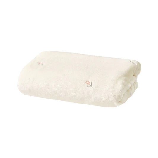 Versatile baby blanket in a neutral tone, suited for unisex infant comfort & decor.