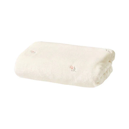 Versatile baby blanket in a neutral tone, suited for unisex infant comfort & decor.