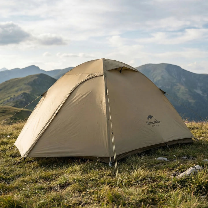 Ultralight 2-person backpacking dome tent, 3-season, setup in a forest clearing for camping and hiking adventures.