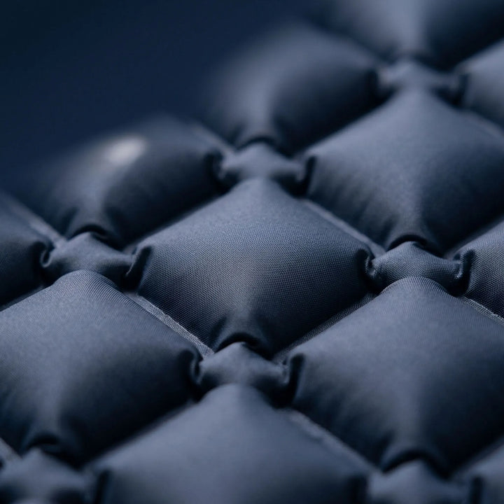 Compact & portable ultralight sleeping pad with built-in pillow, ideal outdoor gear for hikers & campers.