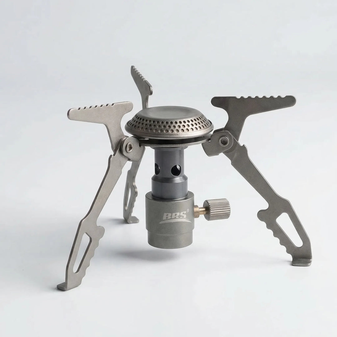 Compact folding titanium camping stove, perfect for ultralight backpacking, hiking & outdoor survival cooking.