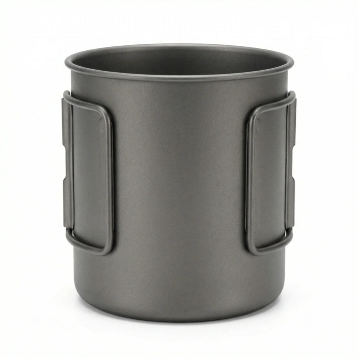 Lightweight titanium outdoor cup with a heat-resistant, foldable handle for camp kitchen.