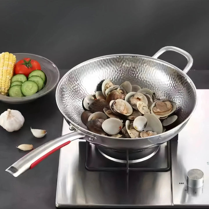 Uncoated titanium wok, round bottom for induction cooktops. Durable cookware for healthy stir-fries.