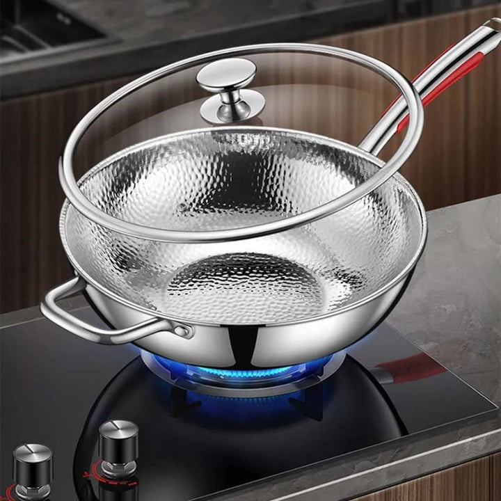 High-quality titanium wok with traditional round bottom, ideal for stir-frying and induction cooking.