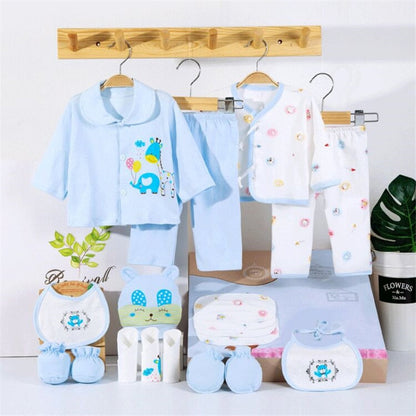 Close-up of soft cotton fabric and 'dinosaur' pattern print from a newborn baby clothing set (0-3M)