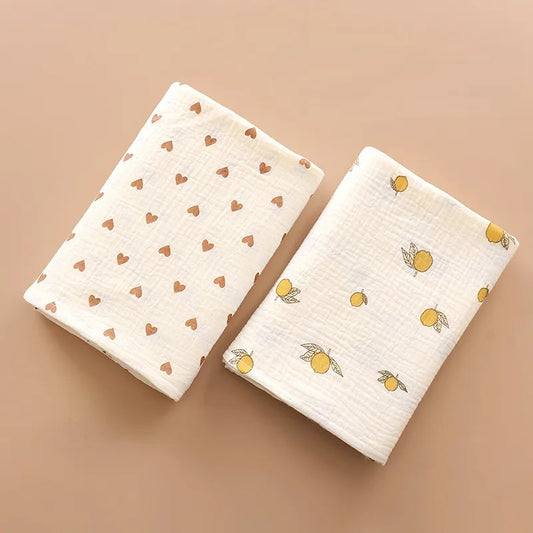 Unisex 2-layer cotton muslin swaddle blanket, soft white fabric, ideal for newborn comfort and sleep