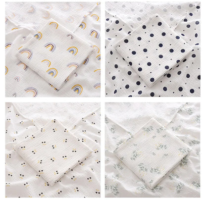 Tag detail on a 2-layer cotton muslin swaddle blanket, highlighting natural cotton and baby comfort