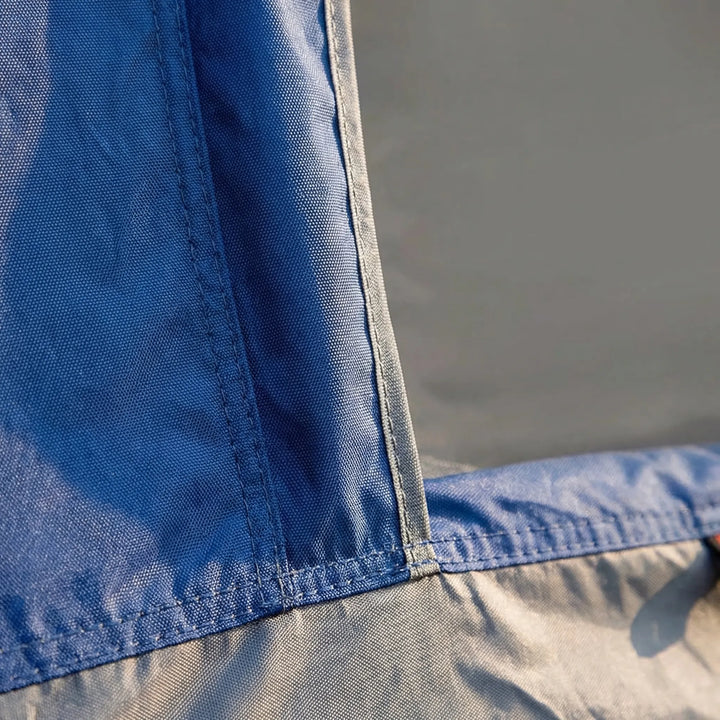 Waterproof & windproof 2-person camping tent pitched by a lake, showcasing durability for all weather conditions.