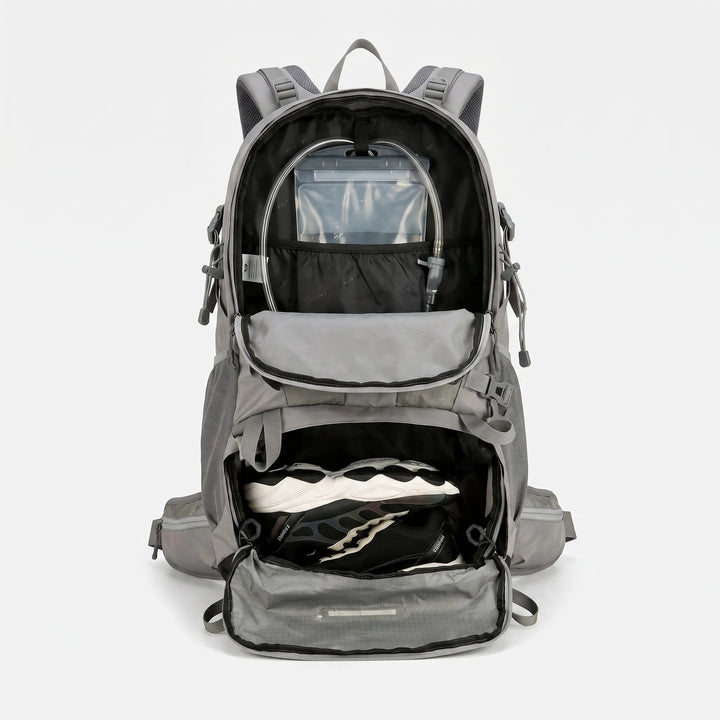 Person wearing a grey 20 Gallon unisex hiking backpack, ready for a long trek or camping expedition.