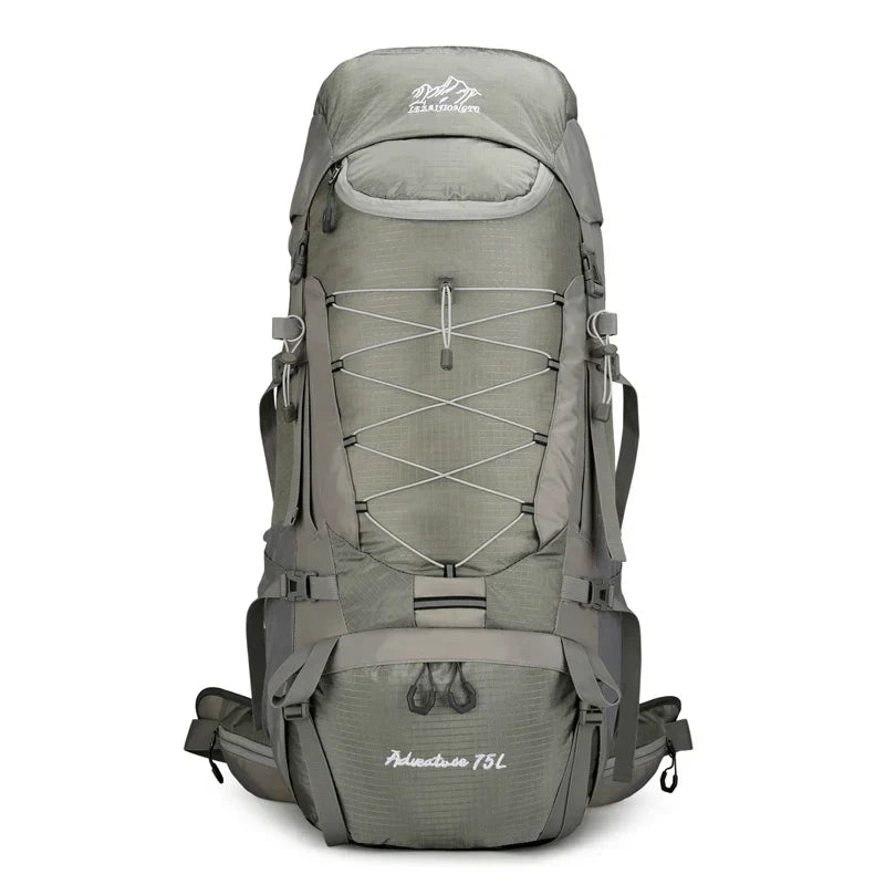 20 Gallon unisex expedition backpack propped on rocks, perfect gear for a challenging outdoor adventure hike.