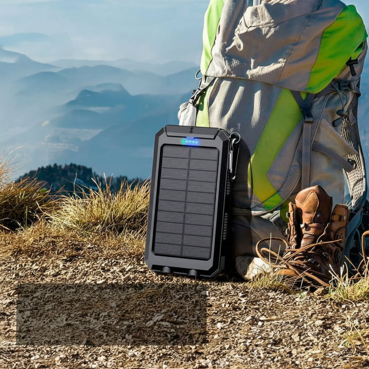 Waterproof 20000mAh solar power bank. Outdoor gear for charging devices with sunlight. Portable emergency power.