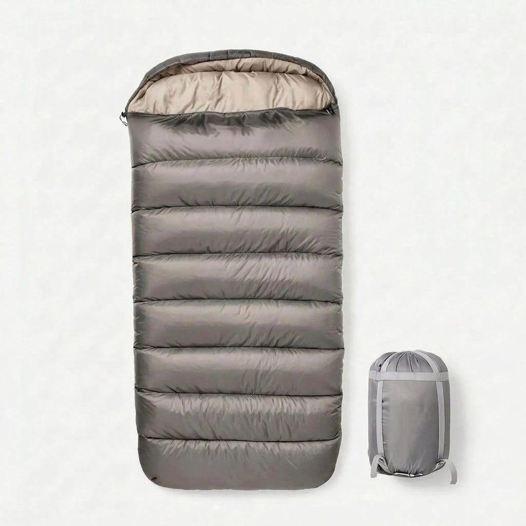 Durable grey unisex 3-season sleeping bag. Essential lightweight gear for comfortable camping & hiking adventures.