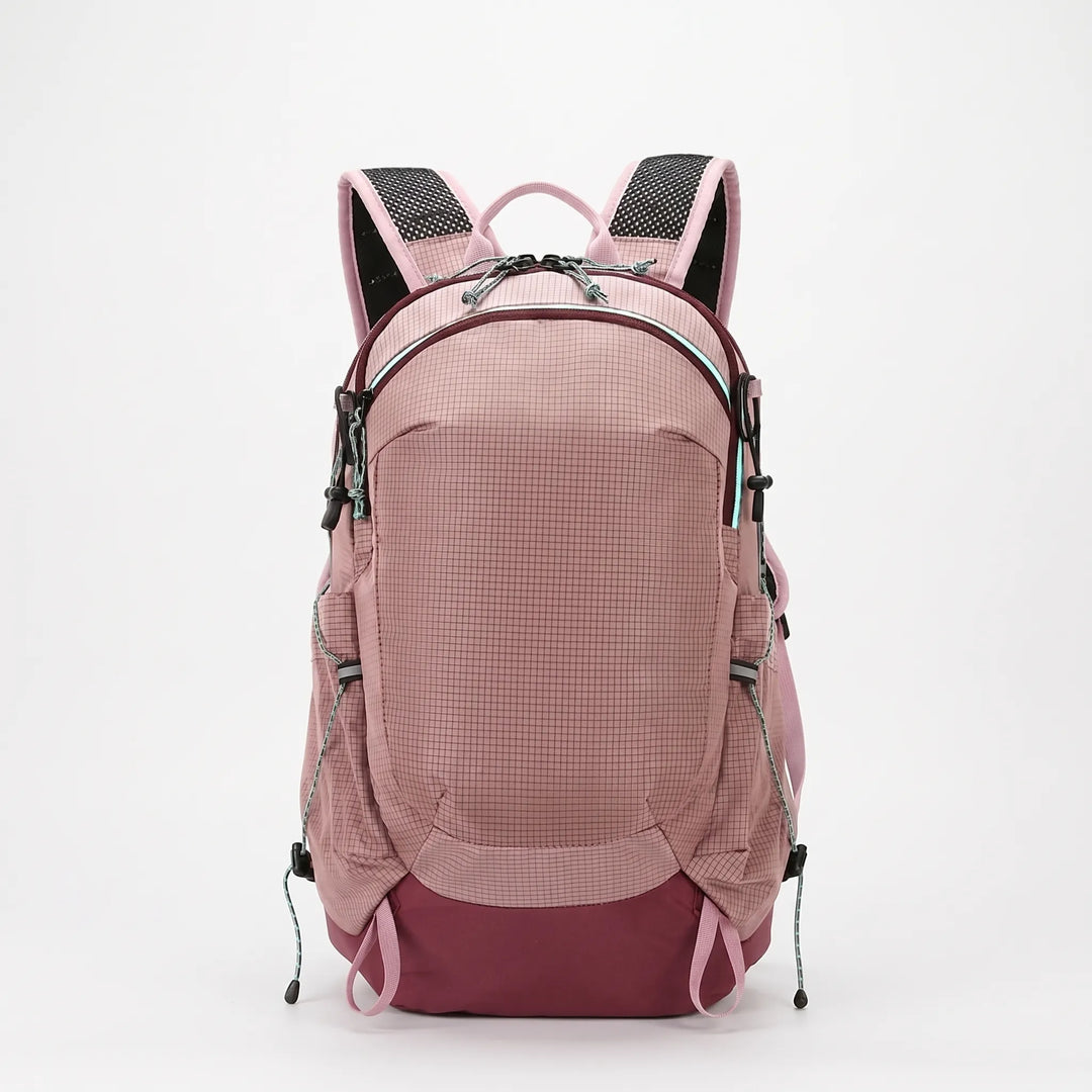 Side view of a water-resistant hiking backpack showing mesh pockets, great for trail hydration.