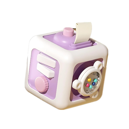 Close-up of a vibrant TinkerCube fidget toy, highlighting its tactile buttons and gears for toddlers