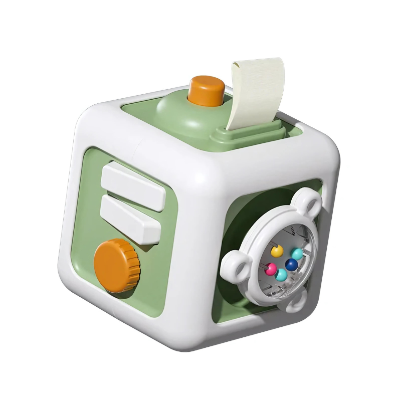 Child's hands engaging with a multi-sided TinkerCube sensory toy, promoting early development