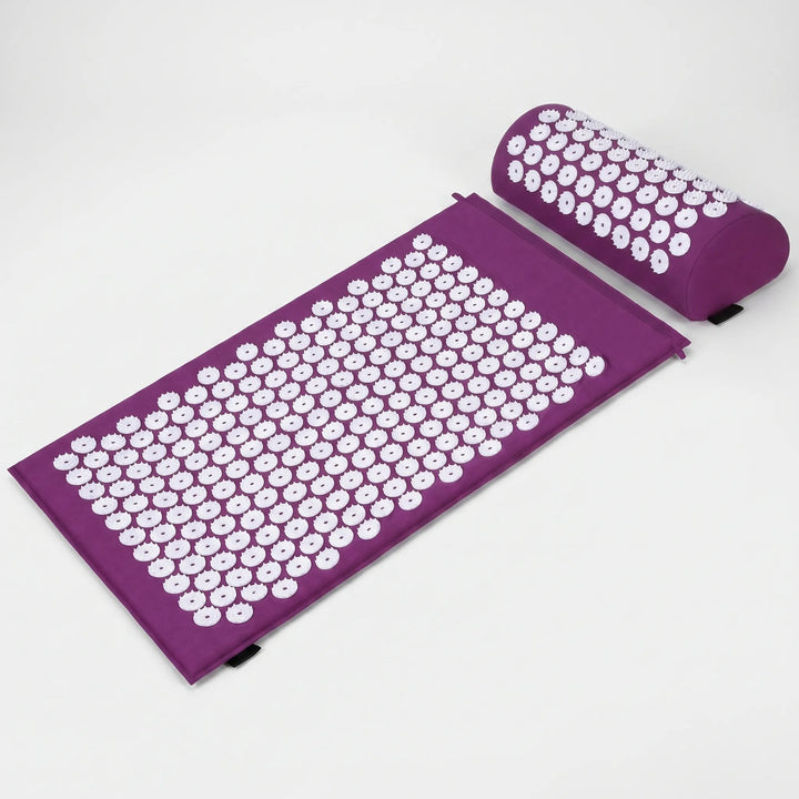 Close-up of green acupressure mat spikes & matching pillow, designed for muscle tension relief.