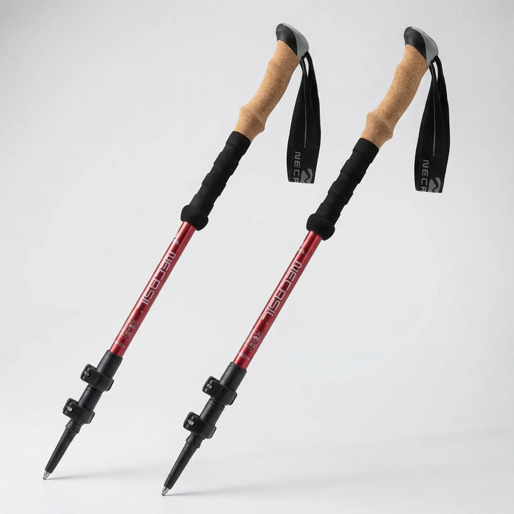 Hiker using adjustable telescoping trekking poles on a mountain trail, providing stability and support.