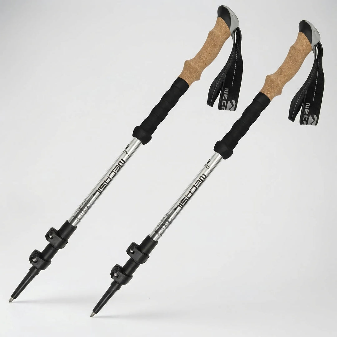 Adjustable hiking poles featuring ergonomic cork grips and rugged tungsten carbide tips for varied terrain.