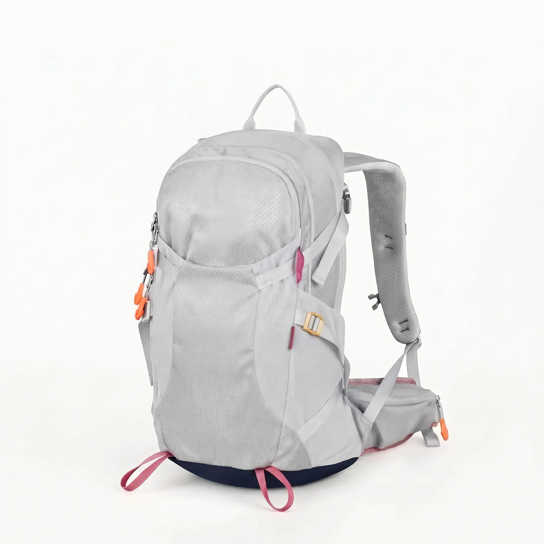 Water-resistant Unisex Hiking Backpack on a scenic trail, essential gear for outdoor adventure & travel.