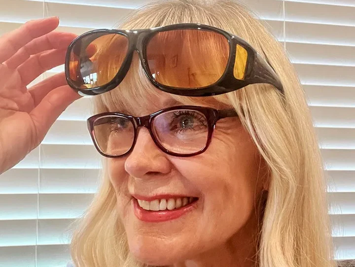 Stylish unisex night driving glasses with glare reduction lenses, essential eyewear for safer road travel.