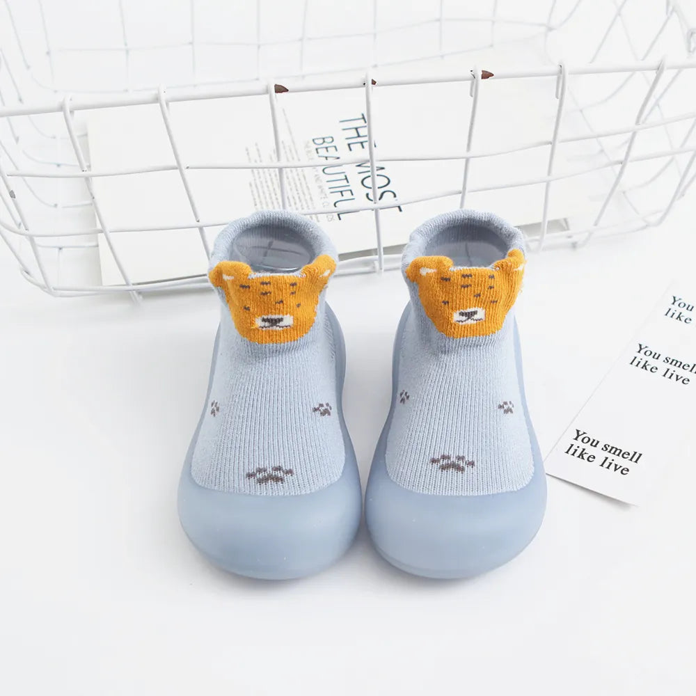Black anti-slip infant socks with a strong rubber sole, stylish and safe for beginning walkers.