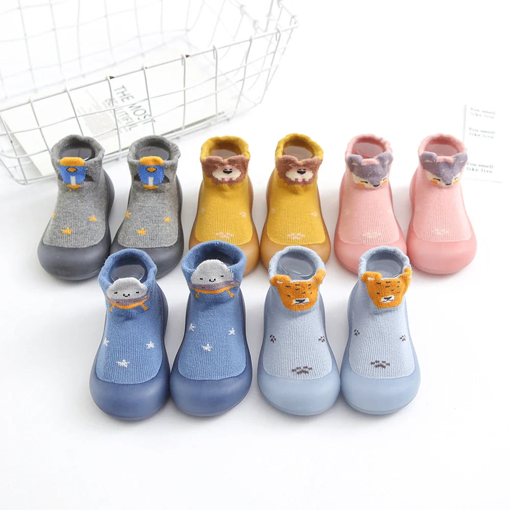 Anti-slip baby walking shoes, sock-style with a full rubber sole for early development.