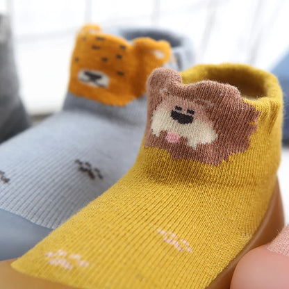 Unisex baby anti-slip socks, grey marl cotton with a non-slip rubber sole for safety.