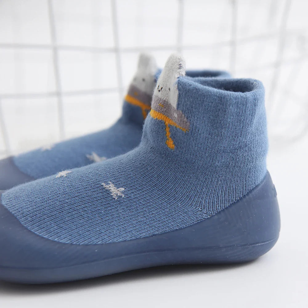 Anti-slip infant footwear, sock and shoe hybrid with a flexible rubber sole, easy to wear.