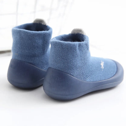Yellow anti-slip baby socks, soft and breathable cotton with full rubber sole for traction.