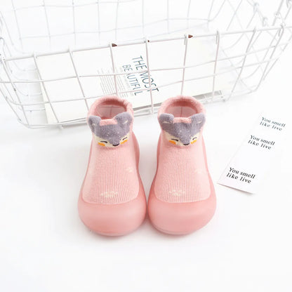 Orange anti-slip baby socks, breathable cotton and flexible rubber sole, ideal for crawling.