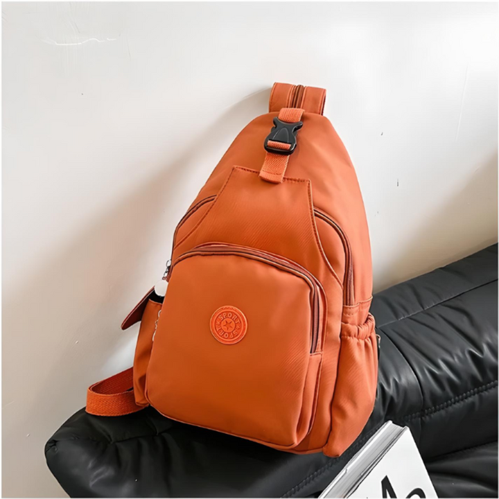 Compact cross-body anti-theft sling bag, perfect for urban travel. Lightweight with secure zippers for daily essentials.