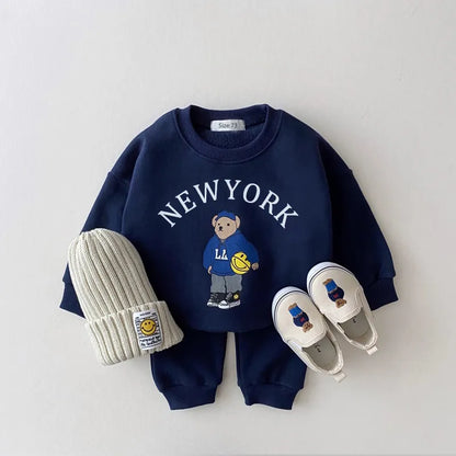 Full view of a unisex baby's cotton hoodie and pants set with bear graphic, ideal for toddlers.