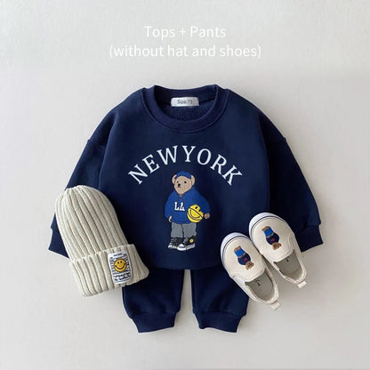 Back view of a unisex baby hoodie and pants set, perfect as a baby gift, cozy children's wear.