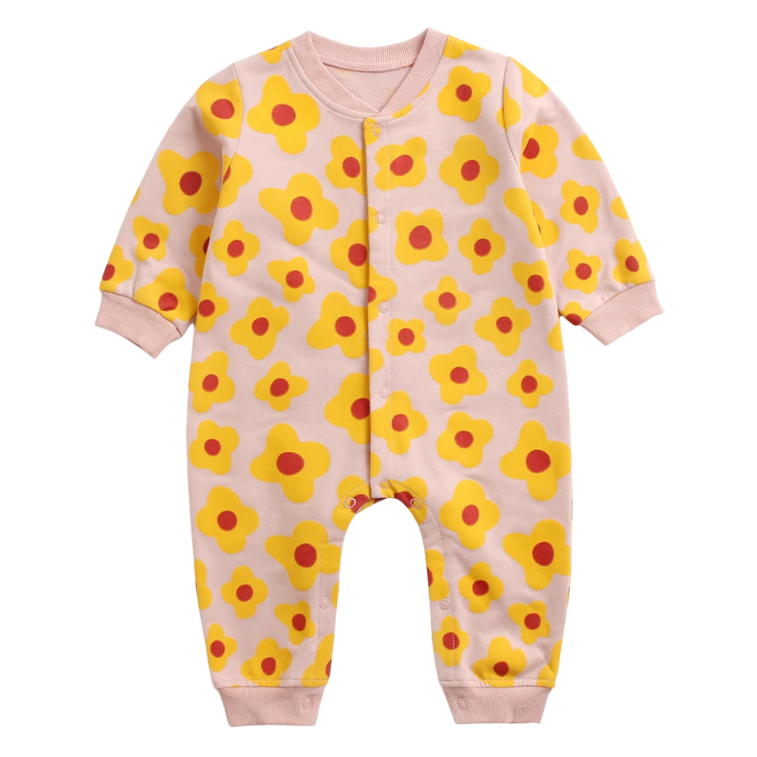 Baby model wearing a unisex long sleeve cotton jumpsuit with cheerful cartoon graphics, a great baby gift.