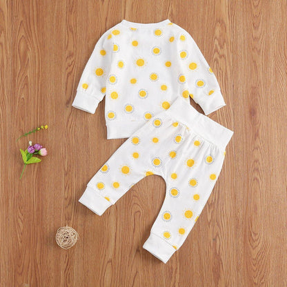 Back view of a unisex baby Sunny Sun Print Pajama Set, showcasing the playful sun pattern