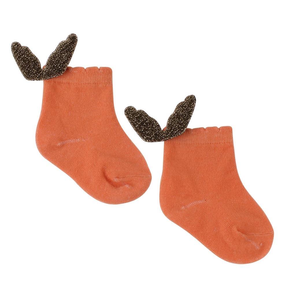 Soft pink infant anti-slip socks with cute angel wings, ideal for new walkers