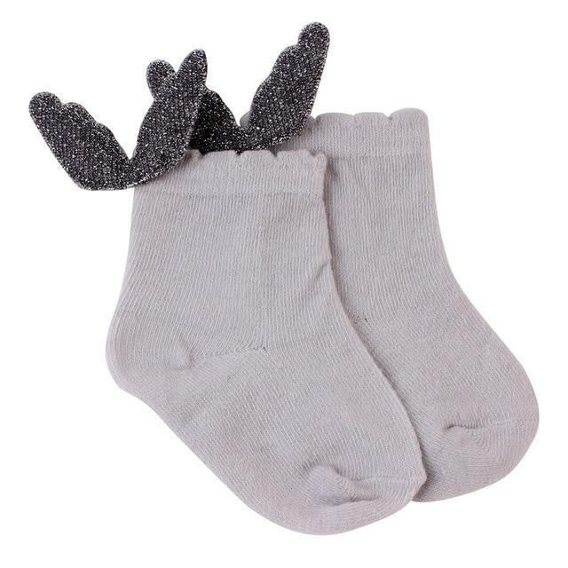 Detail of silicone anti-slip grips on baby angel wings socks for crawling aid