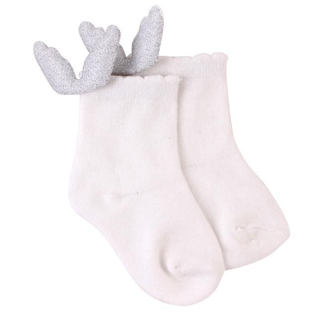 Adorable baby feet in anti-slip angel wings socks, a cozy walking aid