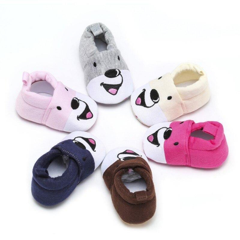 Unisex baby anti-slip cotton shoes in bear cub design, perfect for first walkers.
