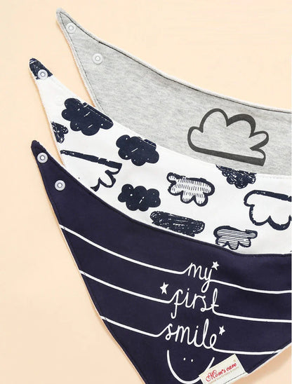 Close-up of a soft cotton bandana bib for baby, featuring a cute animal print, absorbent drool catcher