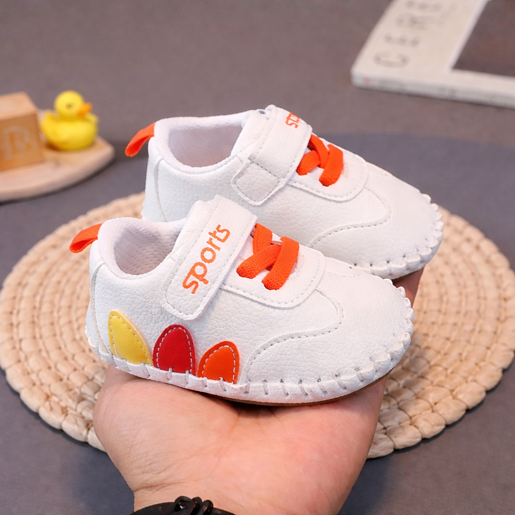 Unisex baby brown leather moccasins with soft anti-slip sole and hook-and-loop closure, perfect for first walkers