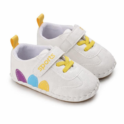 Pair of unisex baby moccasin shoes in dark brown, made from soft leather with an anti-slip design