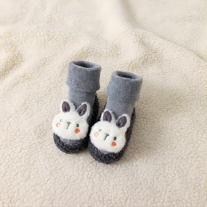 Unisex baby bunny sock shoes with soft sole, non-slip grip, and cute bunny face design, ideal for first walkers.