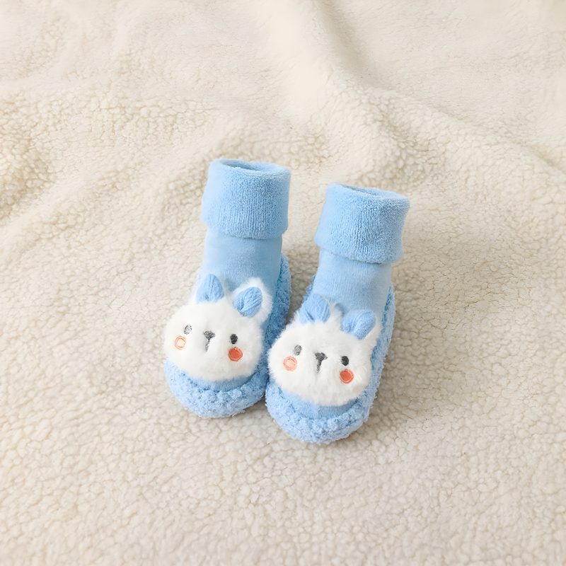 Pair of unisex baby bunny sock shoes with an adorable embroidered bunny face, perfect for new walkers.