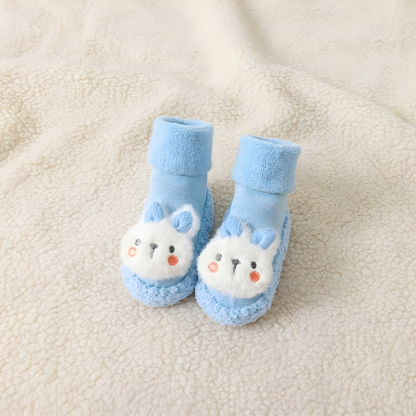 Pair of unisex baby bunny sock shoes with an adorable embroidered bunny face, perfect for new walkers.
