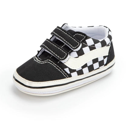 Close-up of soft sole on unisex baby canvas first walkers, ensuring grip and flexibility.